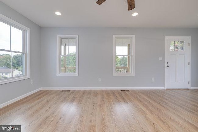 interior space featuring light hardwood / wood-style floors and ceiling fan