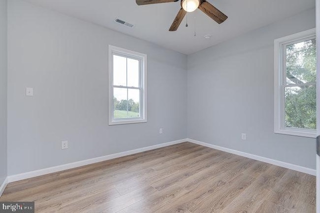 unfurnished room with ceiling fan and light hardwood / wood-style flooring