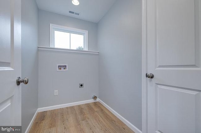 laundry area with light hardwood / wood-style flooring, hookup for an electric dryer, and washer hookup