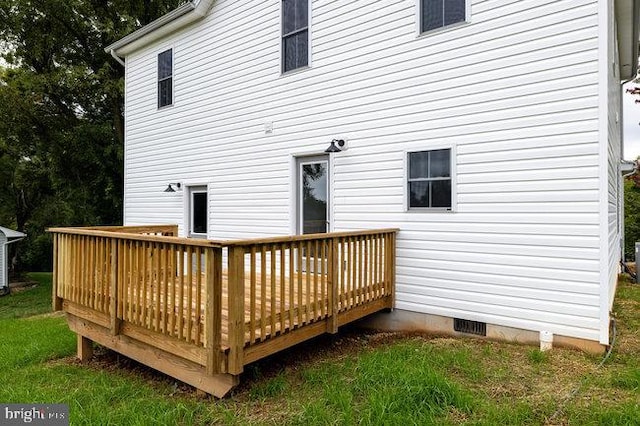 back of property with a deck