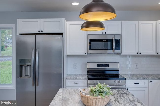 kitchen featuring white cabinets and appliances with stainless steel finishes