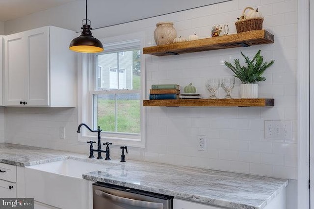 kitchen with dishwasher, a healthy amount of sunlight, and white cabinetry