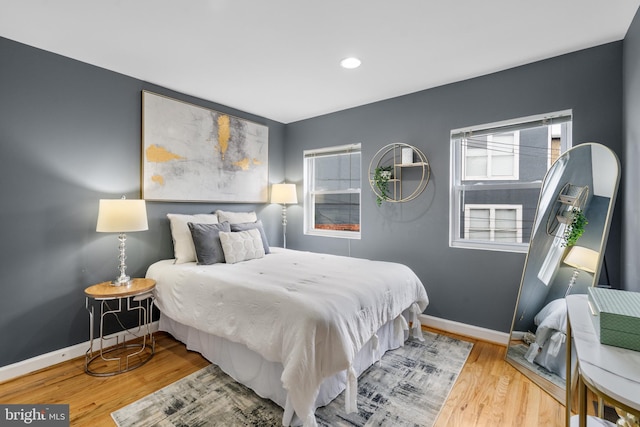 bedroom with light hardwood / wood-style flooring