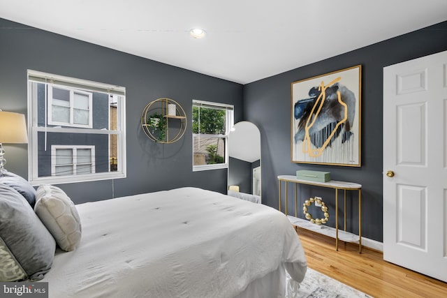 bedroom with hardwood / wood-style floors