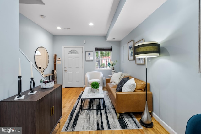 living room with light hardwood / wood-style floors