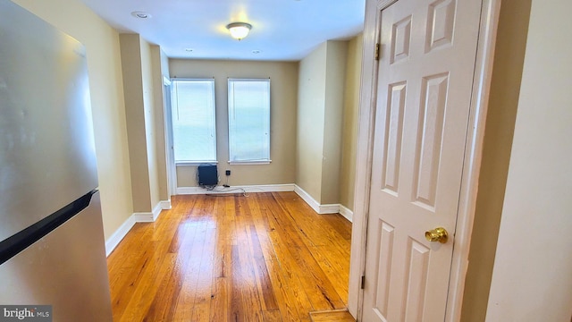 unfurnished room with light hardwood / wood-style floors