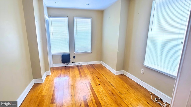 spare room with light hardwood / wood-style flooring