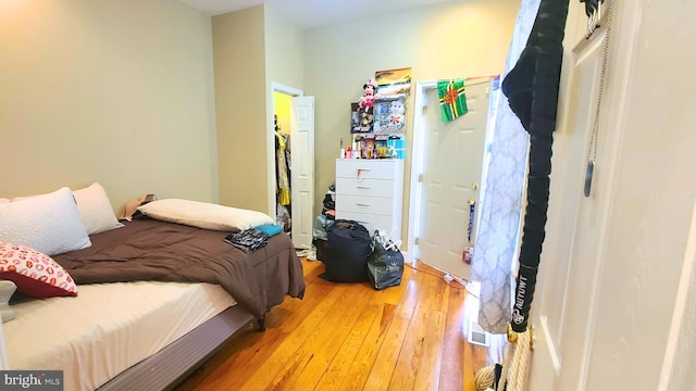 bedroom with hardwood / wood-style floors