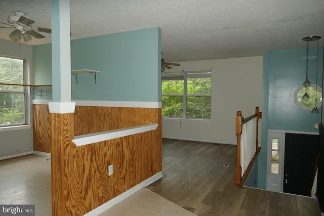 interior space with wood-type flooring and a textured ceiling