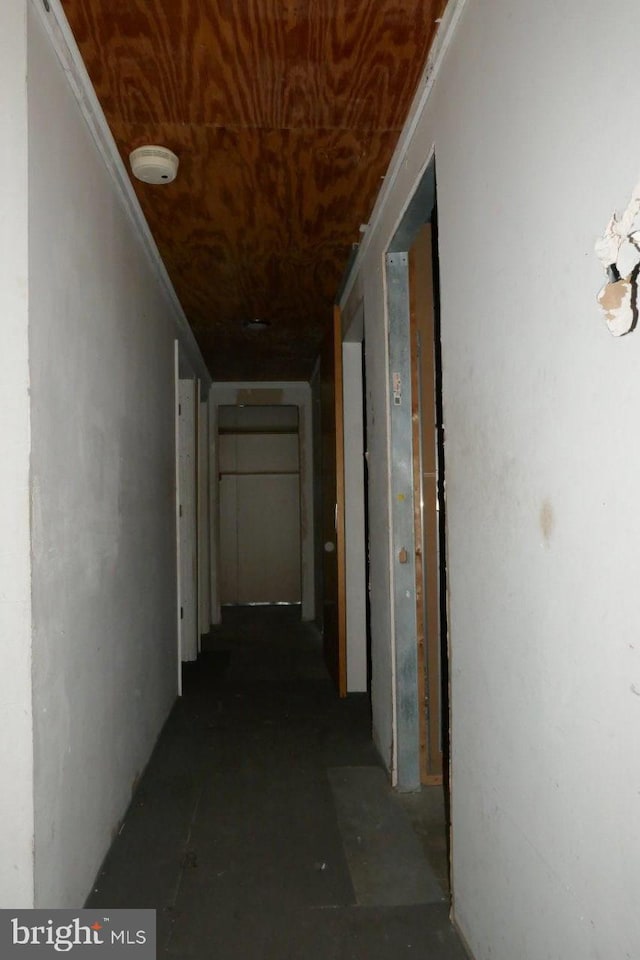 corridor featuring wooden ceiling and ornamental molding