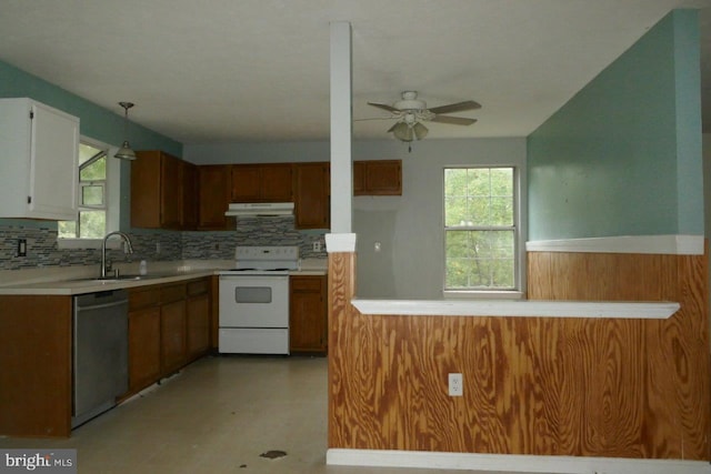 kitchen featuring white range, decorative light fixtures, dishwasher, and plenty of natural light