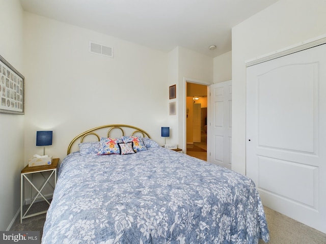 carpeted bedroom featuring a closet