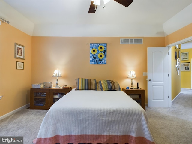 carpeted bedroom with lofted ceiling and ceiling fan