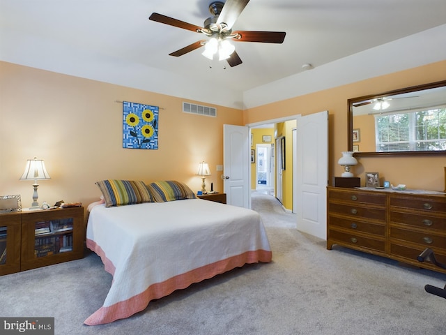 bedroom with light carpet and ceiling fan