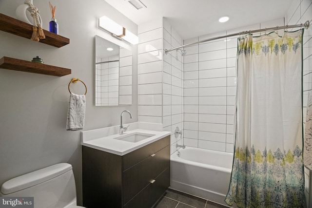 full bathroom with tile patterned flooring, vanity, toilet, and shower / bath combo with shower curtain