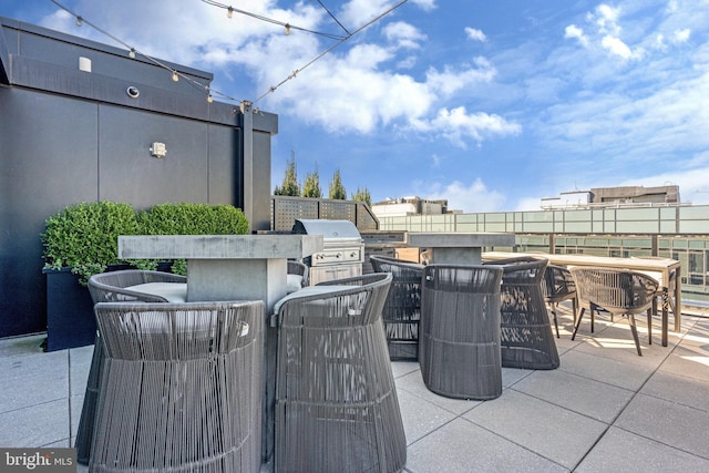 view of patio with area for grilling and grilling area