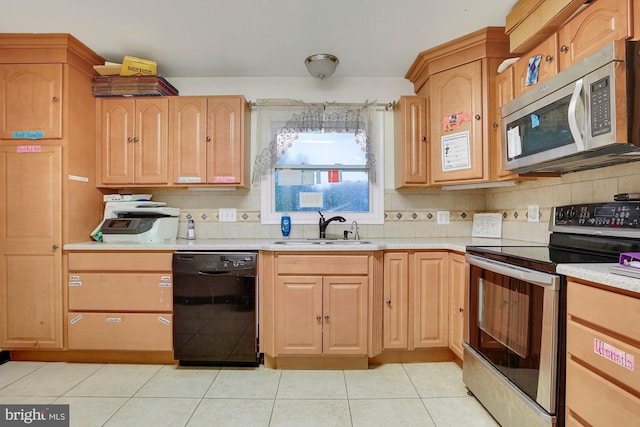 kitchen with light tile patterned flooring, sink, range with electric cooktop, black dishwasher, and decorative backsplash