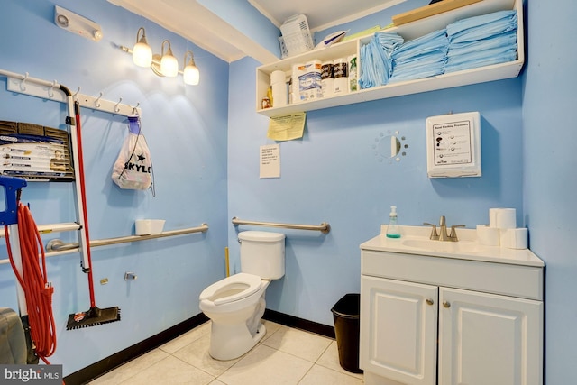 bathroom featuring tile patterned floors, vanity, and toilet