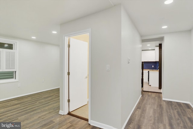 corridor featuring hardwood / wood-style flooring