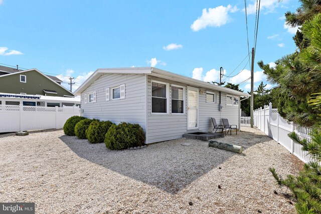 rear view of house featuring a patio