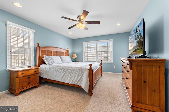 bedroom featuring ceiling fan and light carpet