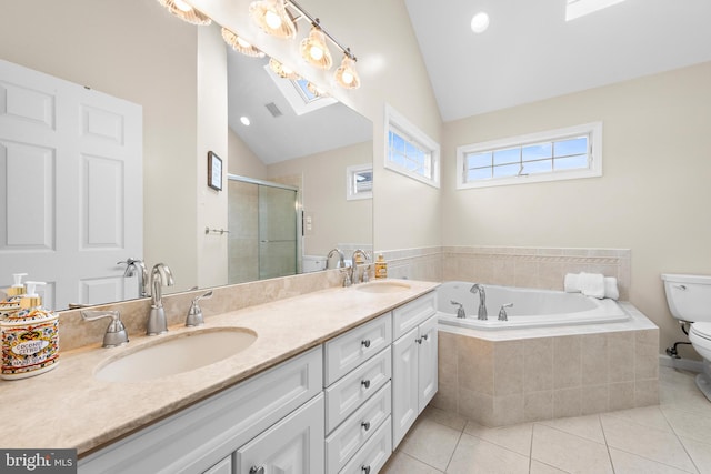 full bathroom with tile patterned flooring, lofted ceiling, separate shower and tub, vanity, and toilet