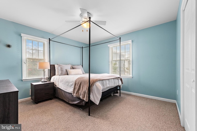 bedroom featuring light carpet and ceiling fan