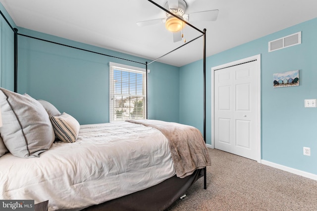 carpeted bedroom with a closet and ceiling fan