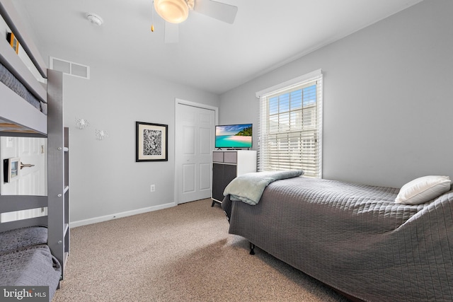 carpeted bedroom with ceiling fan