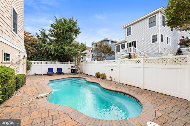 view of swimming pool with a patio area