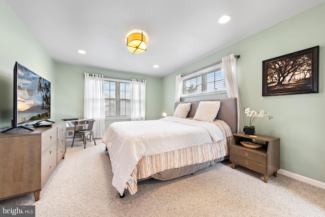 bedroom featuring light carpet