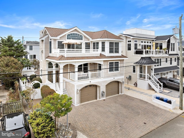 view of front of house with a balcony and a garage