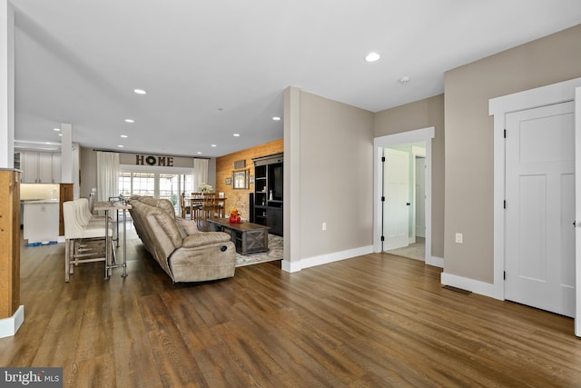 living room with dark wood-type flooring