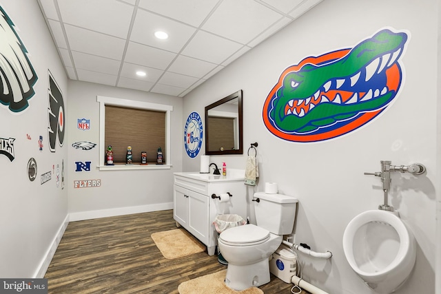 bathroom featuring a paneled ceiling, vanity, wood-type flooring, and toilet