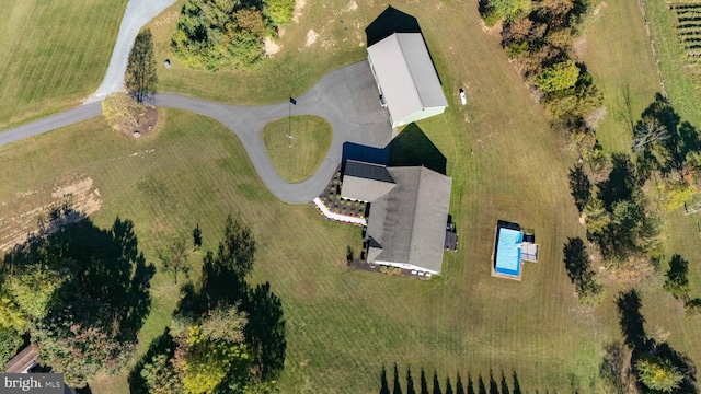 birds eye view of property with a rural view