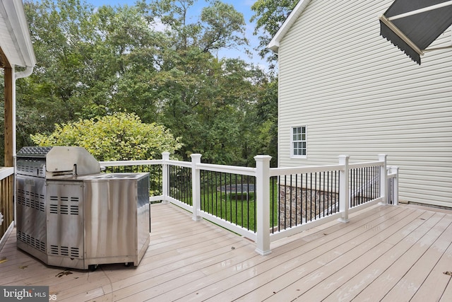 wooden terrace featuring area for grilling