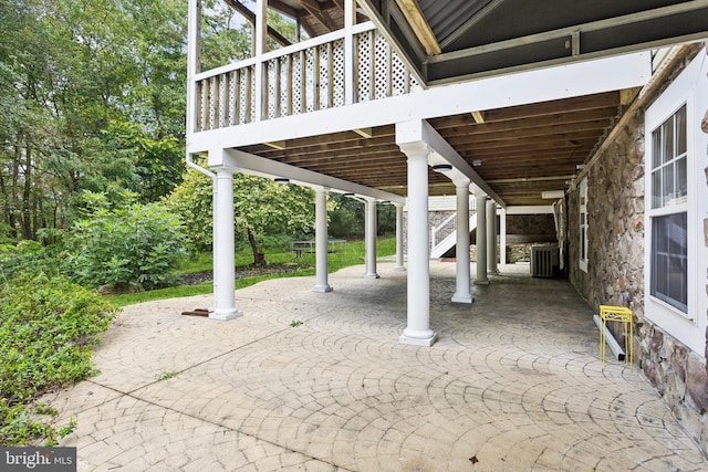 view of patio featuring stairs and cooling unit