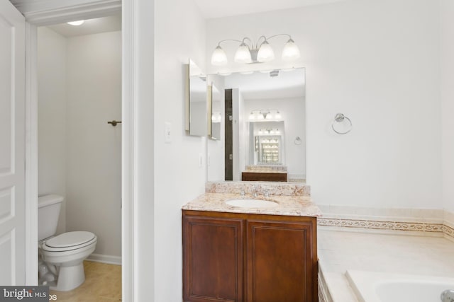 bathroom with vanity, a tub to relax in, toilet, and tile patterned floors