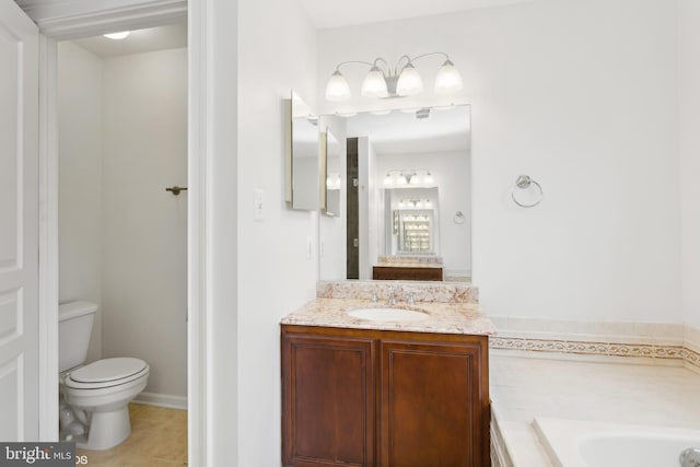 bathroom with toilet, vanity, tile patterned flooring, and a tub to relax in