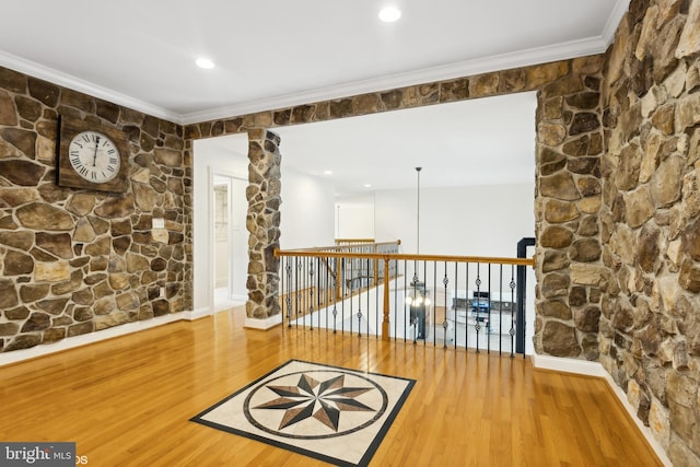 interior space featuring ornamental molding, wood finished floors, and recessed lighting