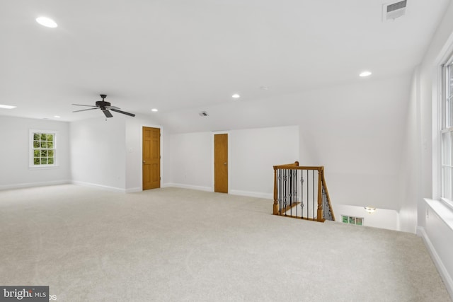 carpeted empty room featuring ceiling fan