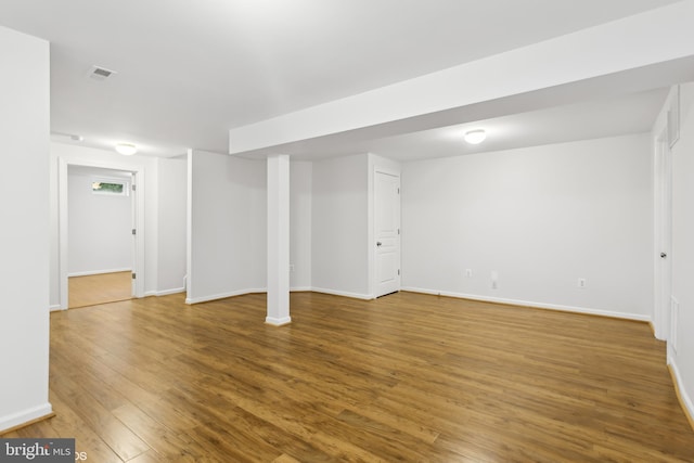 basement featuring wood-type flooring