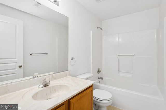 full bathroom featuring toilet, vanity, shower / washtub combination, and visible vents
