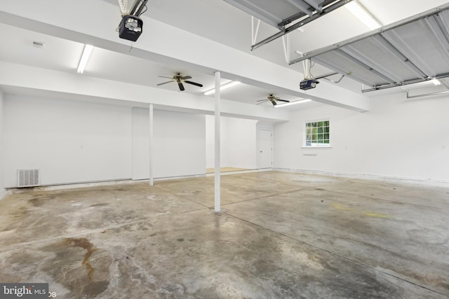 garage featuring ceiling fan and a garage door opener