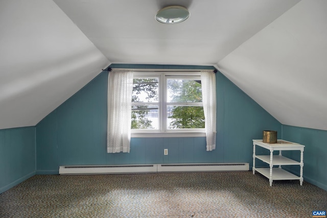 bonus room featuring lofted ceiling, dark carpet, and a baseboard radiator