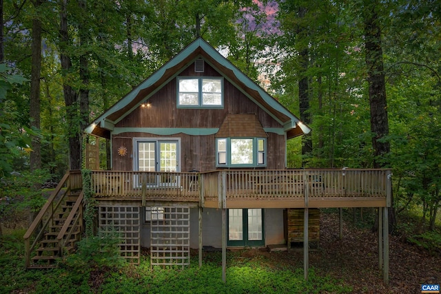 back of property with a wooden deck