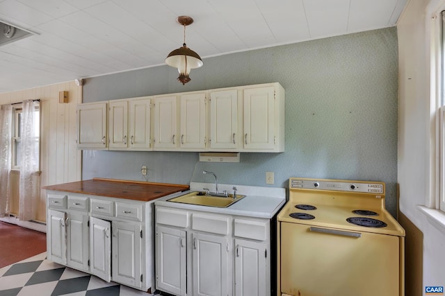 kitchen featuring white cabinets, sink, decorative light fixtures, electric stove, and a baseboard radiator