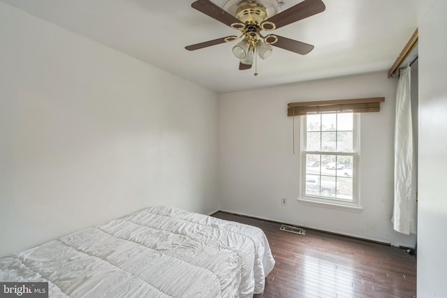 bedroom featuring dark wood-type flooring and ceiling fan