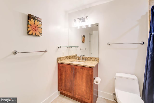 bathroom with toilet and vanity