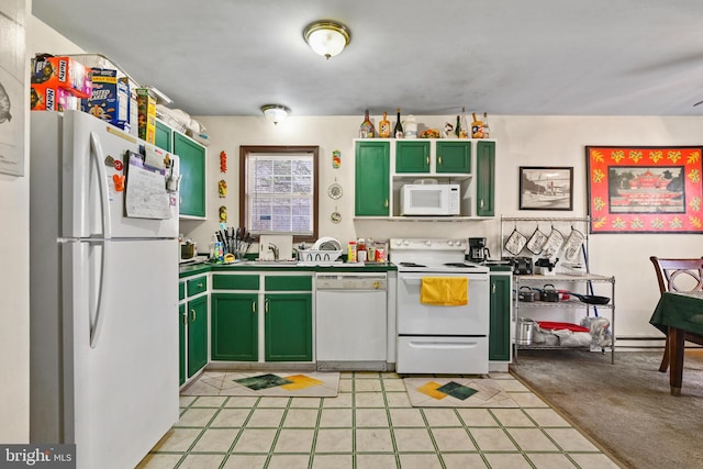 kitchen featuring light colored carpet, green cabinetry, sink, and white appliances